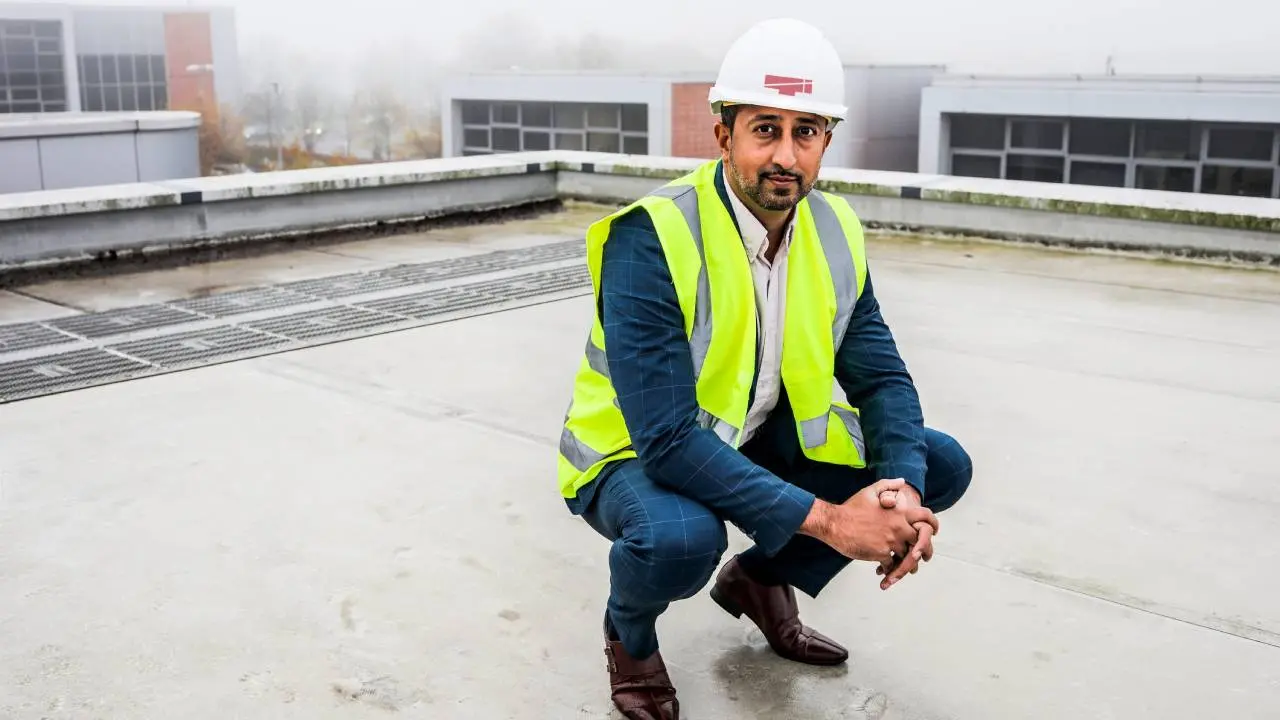 Aman Chahal, TaperedPlus founder, in a crouching stance looking straight at the camera.