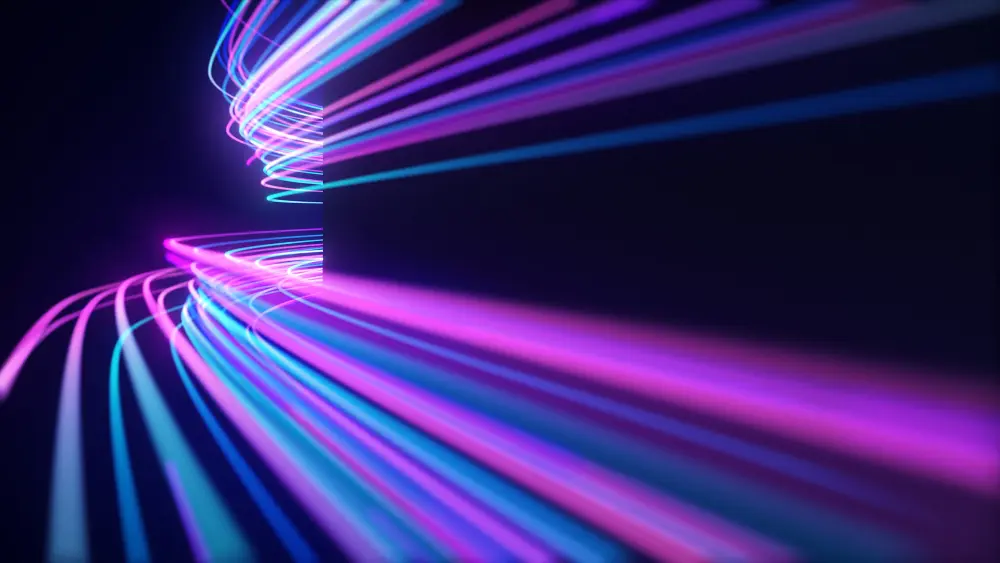 An abstract graphic with glowing neon light trails in purple, pink, and blue, curving across a dark background. The light trails converge and spiral in the middle of the image.