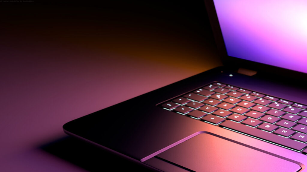 A close-up of a laptop keyboard and trackpad illuminated by a purple and pink glow.