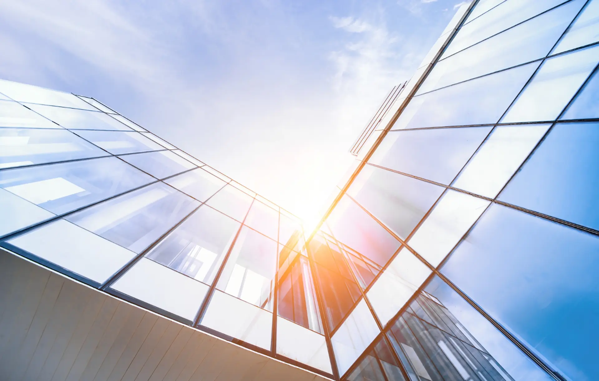 Glass buildings with a sunny blue sky background