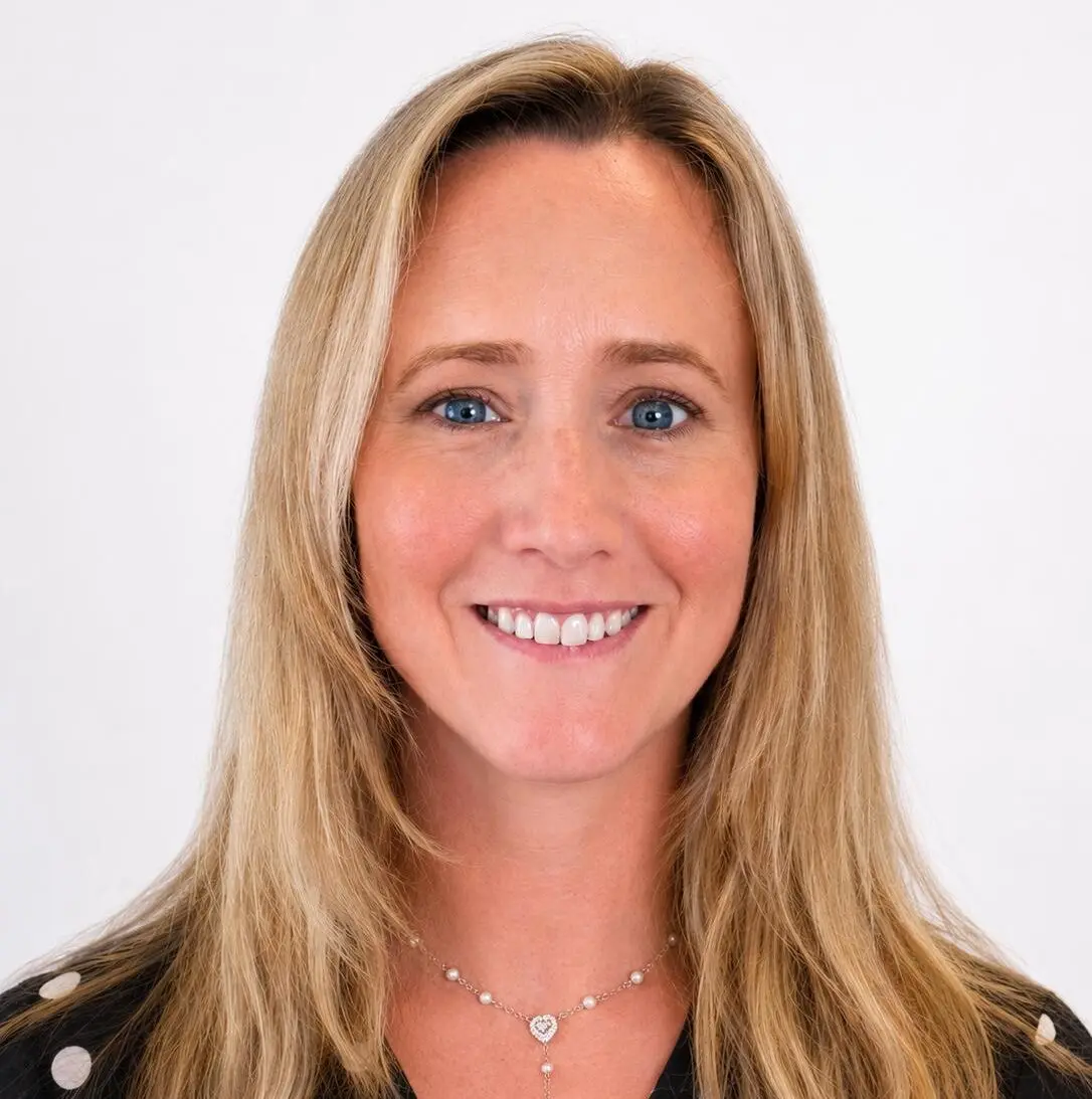 A headshot of a woman smiling